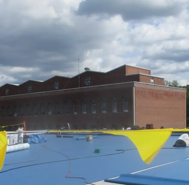 Roof replacement in progress on a public building in New York